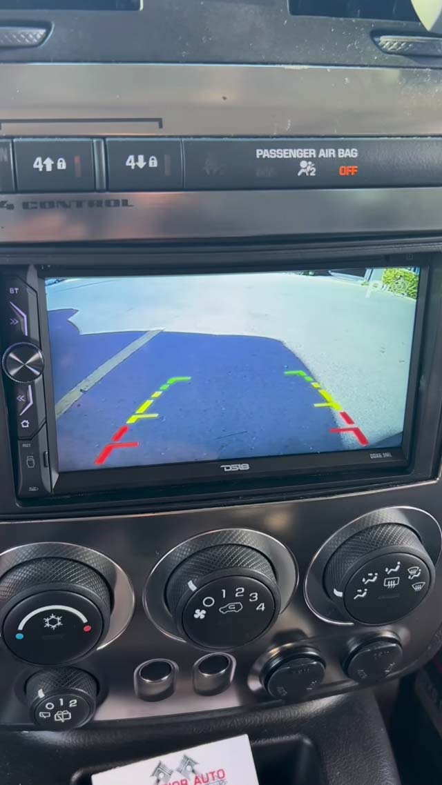 Head unit and backup camera installed and sold by Digital Customs & Electronics Cayman Islands